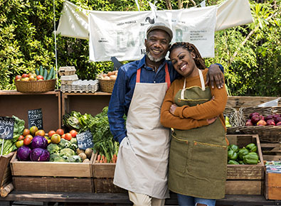 man and woman at a farmers market